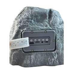 Parlante bluetooth con panel solar en forma de piedra